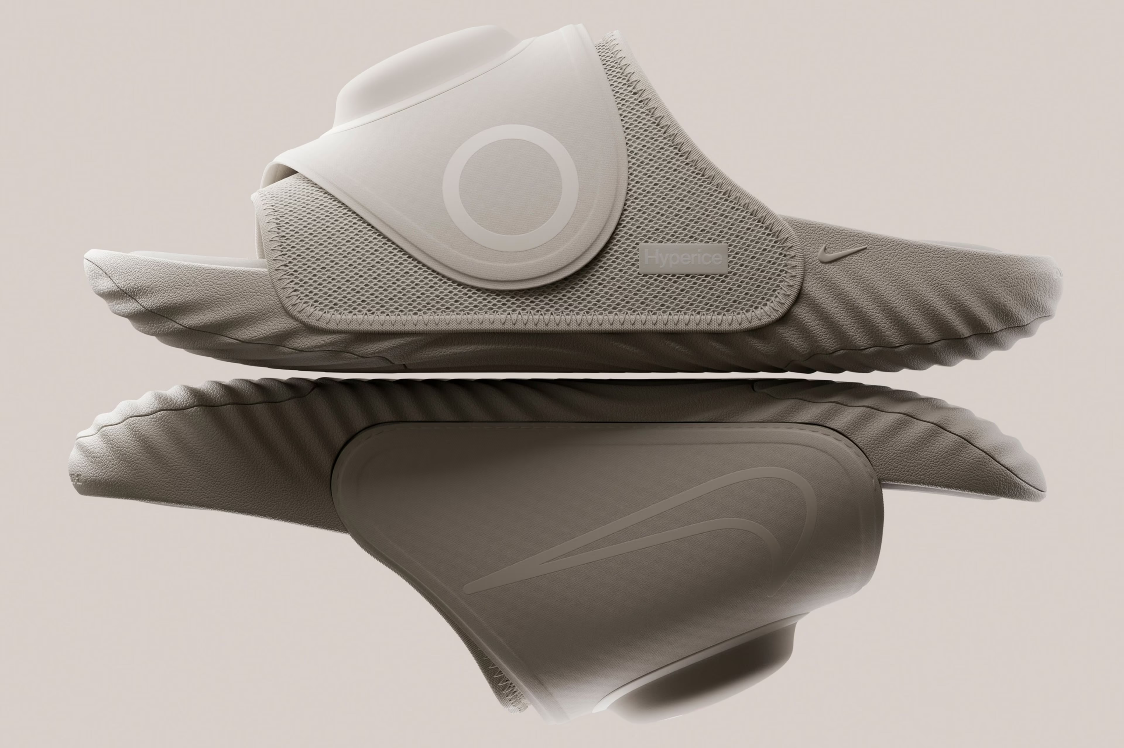 Taupe Hyperslide pair showing waffle sole pattern and side embossed swoosh